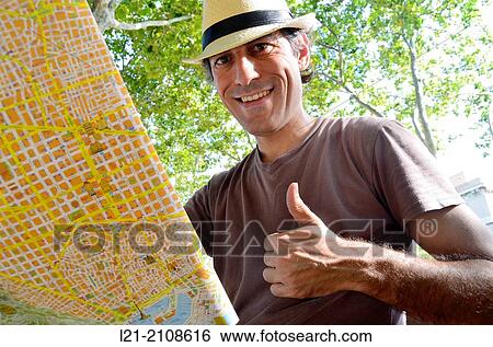 Tourist looking at map View Large Photo Image Stock Photograph - Tourist looking at map. Fotosearch