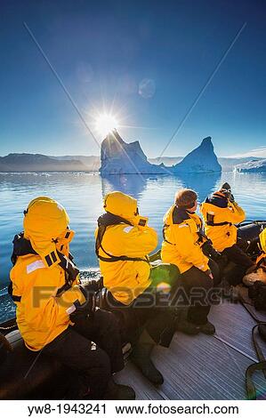 Tourist on Zodiacs exploring and photographing Icebergs, Scoresbysund, Greenland. View Large Photo Image Stock Image - Tourist on Zodiacs exploring and photographing Icebergs, Scoresbysund, Greenland.. Fotosearch