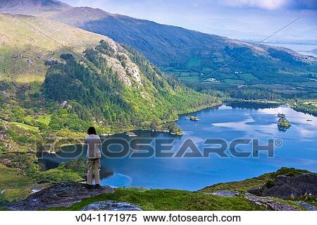 Tourist overlooking the lake at Healy Pass in County Kerry, Ireland, Europe View Large Photo Image Stock Photography - Tourist overlooking the lake at Healy Pass in County Kerry, Ireland, Europe. Fotosearch