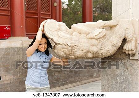 Tourist posing with monument in The Forbidden City, Beijing, China, Asia MR View Large Photo Image Stock Photo - Tourist posing with monument in The Forbidden City, Beijing, China, Asia MR. Fotosearch