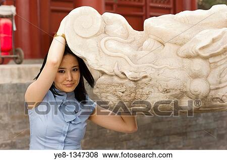 Tourist posing with monument in The Forbidden City, Beijing, China, Asia MR View Large Photo Image Stock Photo - Tourist posing with monument in The Forbidden City, Beijing, China, Asia MR. Fotosearch