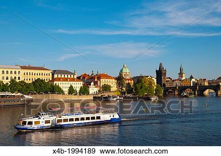 Tourist sightseeing boat on river Vltava with Charles Bridge and old town in background Prague city Czech Republic Europe. View Large Photo Image Stock Photo - Tourist sightseeing boat on river Vltava with Charles Bridge and old town in background Prague city Czech Republic Europe.. Fotosearch