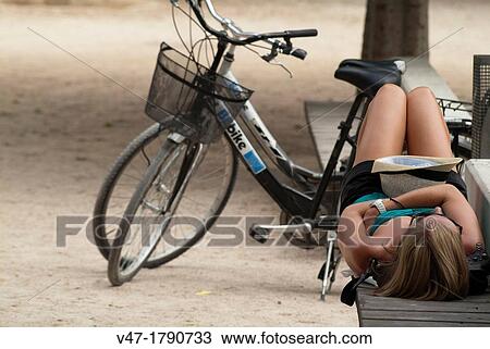 Tourist sleeping sitting on a park bench, park Header, Valencia, comunidad Valenciana, Spain, Europe View Large Photo Image Stock Image - Tourist sleeping sitting on a park bench, park Header, Valencia, comunidad Valenciana, Spain, Europe. Fotosearch