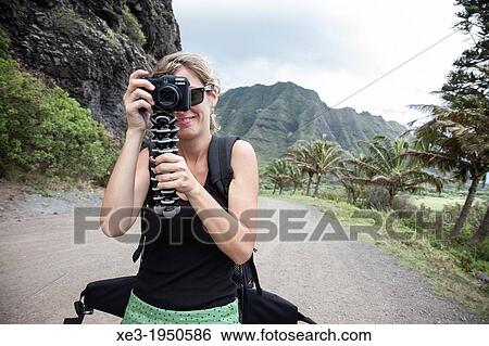 Stock Photograph - Tourist taking pictures, Oahu, Hawaii.. Fotosearch