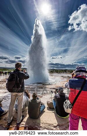 Tourist taking pictures of Strokkur Gesyer erupting, Iceland. View Large Photo Image Stock Image - Tourist taking pictures of Strokkur Gesyer erupting, Iceland.. Fotosearch