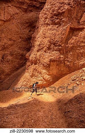 Stock Photo - Tourist trecking the rocky landscape, Bryce Canyon, Utah, USA.. Fotosearch