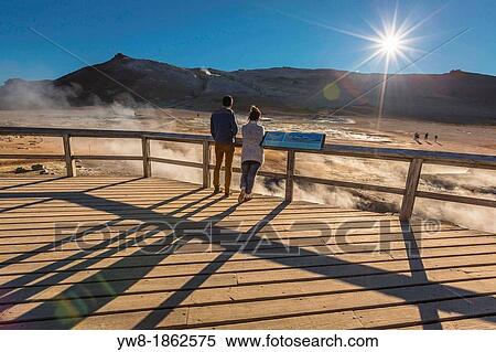 Tourist visiting Namaskard Geothermal Volcanic area, Northern Iceland The Namaskard Volcanic area is characterized by boiling mud-bogs and solfatoras View Large Photo Image Stock Photography - Tourist visiting Namaskard Geothermal Volcanic area, Northern Iceland The Namaskard Volcanic area is characterized by boiling mud-bogs and solfatoras. Fotosearch