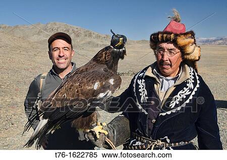 tourist with a Kazakh eagle hunter and his golden eagle in the Altai Region of Bayan-? lgii in Western Mongolia View Large Photo Image Stock Photography - tourist with a Kazakh eagle hunter and his golden eagle in the Altai Region of Bayan-? lgii in Western Mongolia. Fotosearch