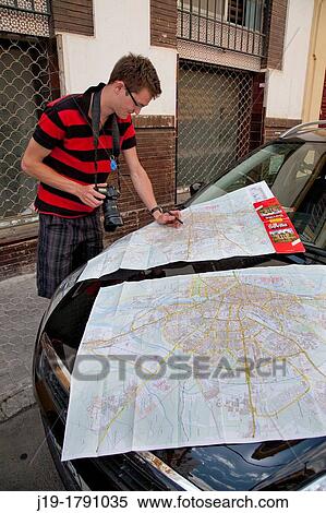 Tourist with map, Seville, Spain View Large Photo Image Stock Photography - Tourist with map, Seville, Spain. Fotosearch