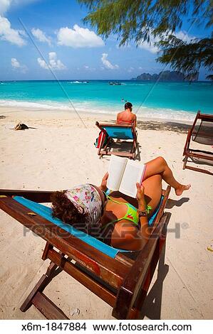 Picture - Tourist woman on Long beach Phi Phi Don island Krabi province, Andaman Sea, Thailand. Fotosearch