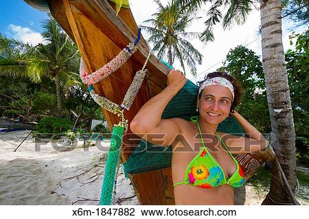 Stock Image - Tourist woman on Long beach Phi Phi Don island Krabi province, Andaman Sea, Thailand. Fotosearch