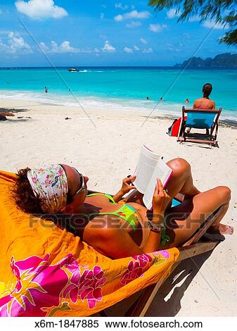 Tourist woman on Long beach Phi Phi Don island Krabi province, Andaman Sea, Thailand View Large Photo Image Stock Photography - Tourist woman on Long beach Phi Phi Don island Krabi province, Andaman Sea, Thailand. Fotosearch