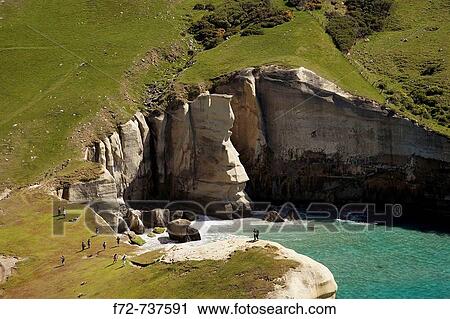 Tourists and Cliffs at Tunnel Beach, Dunedin, South Island, New Zealand - aerial View Large Photo Image Stock Image - Tourists and Cliffs at Tunnel Beach, Dunedin, South Island, New Zealand - aerial. Fotosearch