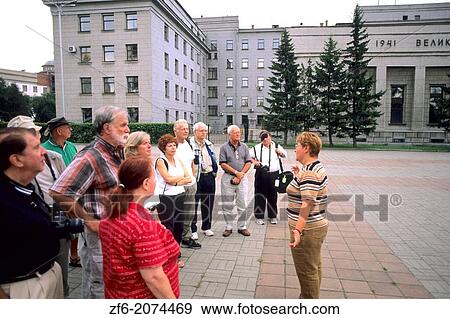 Stock Photo - Tourists and Guide at Victory Park in Irkutsk Siberia Russia.. Fotosearch