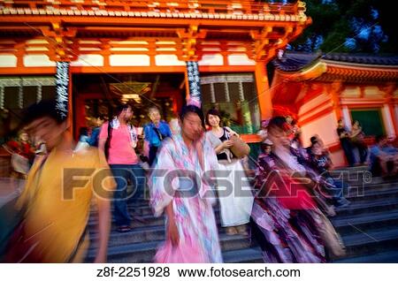 Tourists and pilgrims at the main gate of the Yasaka shrine. View Large Photo Image Stock Photo - Tourists and pilgrims at the main gate of the Yasaka shrine.. Fotosearch