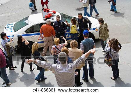 Tourists and police car and cops, Wall Street, New York City, USA View Large Photo Image Stock Image - Tourists and police car and cops, Wall Street, New York City, USA. Fotosearch