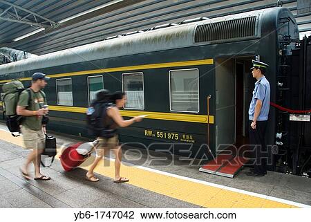 Tourists arriving to the Trans-Mongolian train at the Beijing Station, China. View Large Photo Image Stock Image - Tourists arriving to the Trans-Mongolian train at the Beijing Station, China.. Fotosearch