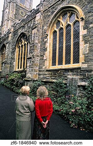 Stock Image - Tourists at Fowley parish church in Fowley England. Fotosearch