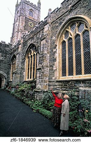 Stock Photo - Tourists at Fowley parish church in Fowley England. Fotosearch