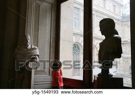 Stock Image - tourists at the louvre museum in paris france. Fotosearch