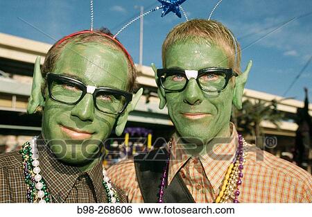 Stock Photograph - Tourists dressed for Mardi Gras holiday. New Orleans. USA. Fotosearch