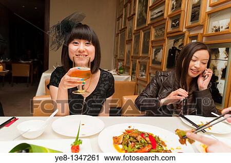 Tourists drinking and calling in a Sichuan cuisine restaurant, Haiyongxiang District, Shanghai, China, Asia MR View Large Photo Image Stock Image - Tourists drinking and calling in a Sichuan cuisine restaurant, Haiyongxiang District, Shanghai, China, Asia MR. Fotosearch