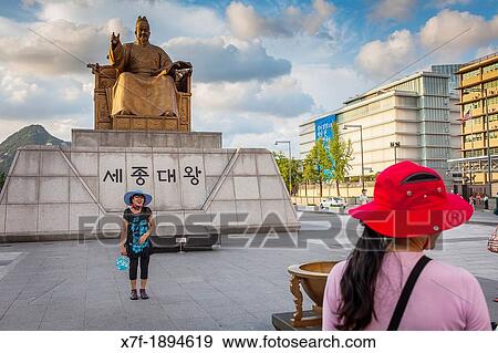 Tourists, Golden statue of King Sae Jong Dae at Gwanghwamun Square in downtown, Seoul, South Korea View Large Photo Image Stock Photo - Tourists, Golden statue of King Sae Jong Dae at Gwanghwamun Square in downtown, Seoul, South Korea. Fotosearch