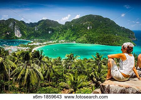 Tourists in a viewpoint Phi Phi Don island Krabi province, Andaman Sea, Thailand View Large Photo Image Stock Image - Tourists in a viewpoint Phi Phi Don island Krabi province, Andaman Sea, Thailand. Fotosearch