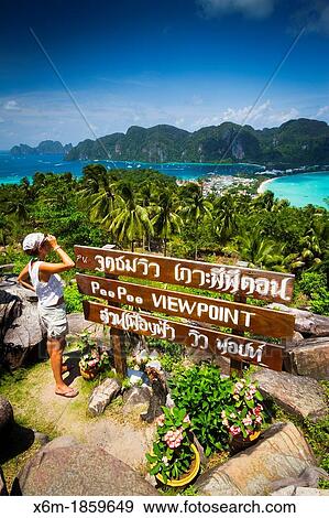 Tourists in a viewpoint Phi Phi Don island Krabi province, Andaman Sea, Thailand View Large Photo Image Stock Photo - Tourists in a viewpoint Phi Phi Don island Krabi province, Andaman Sea, Thailand. Fotosearch