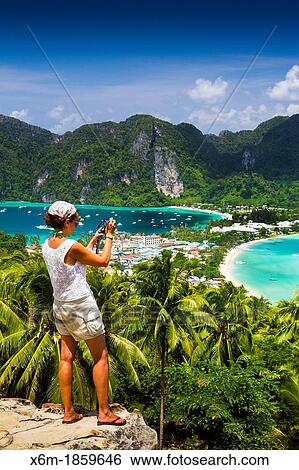 Tourists in a viewpoint Phi Phi Don island Krabi province, Andaman Sea, Thailand View Large Photo Image Stock Photograph - Tourists in a viewpoint Phi Phi Don island Krabi province, Andaman Sea, Thailand. Fotosearch