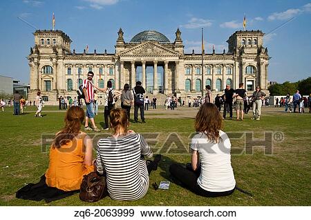 Stock Photo - Tourists in front of the Reichstag in Berlin, Germany.. Fotosearch