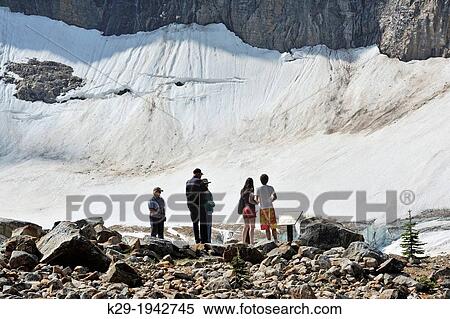 Tourists looking at Cavell Lake from high viewpoint, Jasper National Park, Alberta, Canada. View Large Photo Image Stock Photography - Tourists looking at Cavell Lake from high viewpoint, Jasper National Park, Alberta, Canada.. Fotosearch