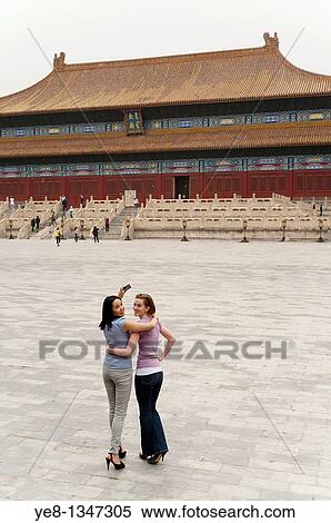 Tourists looking backwards in front of the Hall for Worship Of Ancestors, The Forbidden City, Beijing, China, Asia MR View Large Photo Image Stock Photography - Tourists looking backwards in front of the Hall for Worship Of Ancestors, The Forbidden City, Beijing, China, Asia MR. Fotosearch