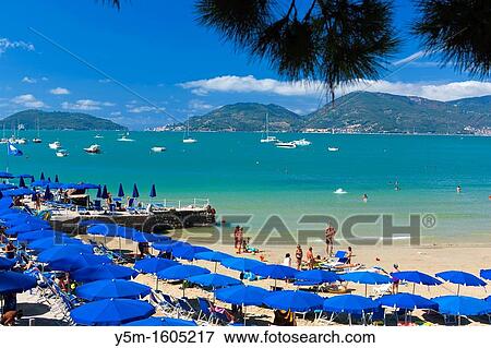 Tourists on the beach, Lerici, Province of La Spezia, Liguria, Italy, Europe View Large Photo Image Stock Photo - Tourists on the beach, Lerici, Province of La Spezia, Liguria, Italy, Europe. Fotosearch