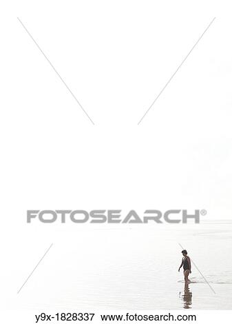 Tourists on the beaches of Sanur at sunset in Bali, Indonesia View Large Photo Image Stock Photo - Tourists on the beaches of Sanur at sunset in Bali, Indonesia. Fotosearch