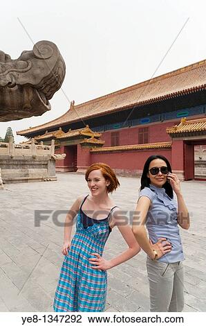 Tourists, one smiling and one calling, The Forbidden City, Beijing, China, Asia MR View Large Photo Image Stock Image - Tourists, one smiling and one calling, The Forbidden City, Beijing, China, Asia MR. Fotosearch