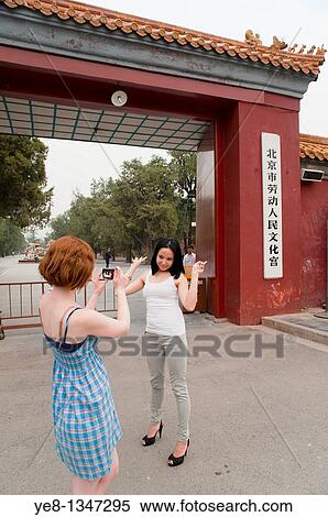 Tourists, one taking photos of the other, South Gate, The Forbidden City, Beijing, China, Asia MR View Large Photo Image Stock Photography - Tourists, one taking photos of the other, South Gate, The Forbidden City, Beijing, China, Asia MR. Fotosearch