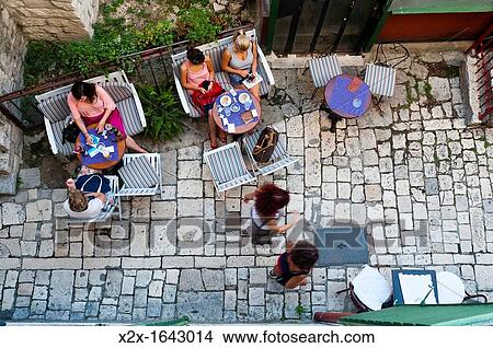 Tourists outside a bar, Split, region of Dalmatia, Croatia, Europe View Large Photo Image Picture - Tourists outside a bar, Split, region of Dalmatia, Croatia, Europe. Fotosearch