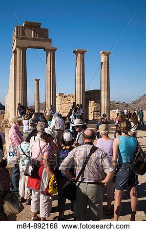 Tourists sightseeing at the Acropolis, Lindos, Rhodes, Greece View Large Photo Image Stock Photo - Tourists sightseeing at the Acropolis, Lindos, Rhodes, Greece. Fotosearch