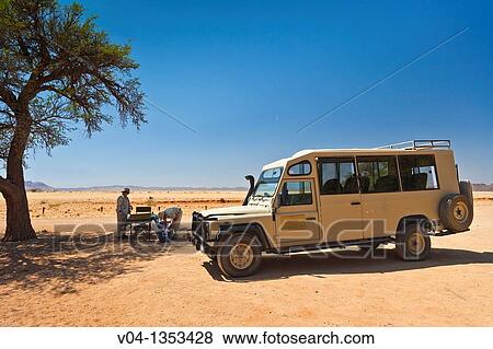 Tourists stopping for a lunch break in the Namib Naukluft Park, Namibia, Africa View Large Photo Image Stock Photo - Tourists stopping for a lunch break in the Namib Naukluft Park, Namibia, Africa. Fotosearch