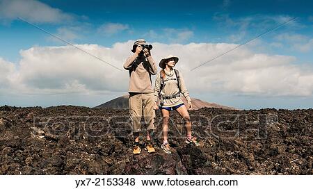 Stock Photo - Tourists taking photos at Timanfaya National Park, Lanzarote, Canary Islands, Spain.. Fotosearch