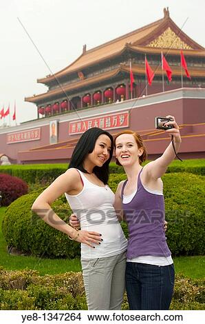 Tourists taking their own photograph in front of The Gate of Heavenly Peace, The Forbidden City, Beijing, China, Asia MR View Large Photo Image Picture - Tourists taking their own photograph in front of The Gate of Heavenly Peace, The Forbidden City, Beijing, China, Asia MR. Fotosearch