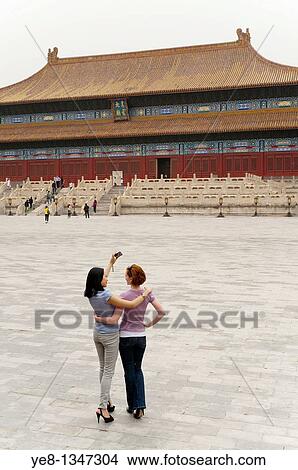 Tourists taking their own photograph in front of the Hall for Worship Of Ancestors, The Forbidden City, Beijing, China, Asia MR View Large Photo Image Picture - Tourists taking their own photograph in front of the Hall for Worship Of Ancestors, The Forbidden City, Beijing, China, Asia MR. Fotosearch
