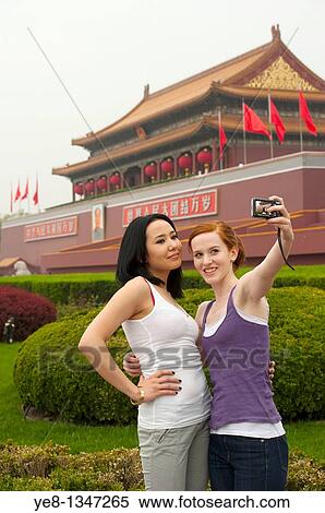 Tourists taking their own photograph in front of The Gate of Heavenly Peace, The Forbidden City, Beijing, China, Asia MR View Large Photo Image Stock Photography - Tourists taking their own photograph in front of The Gate of Heavenly Peace, The Forbidden City, Beijing, China, Asia MR. Fotosearch