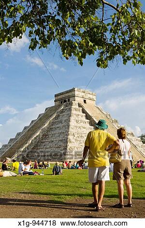 Stock Photo - Tourists viewing El Castillo Pyramid of Kukulcan? The Castle? during the fall equinox at the Mayan site of Chichen Itza, Mexico. Fotosearch