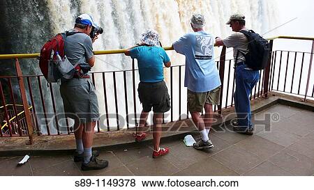Tourists visiting the Iguazu Falls Argentina View Large Photo Image Stock Photo - Tourists visiting the Iguazu Falls Argentina. Fotosearch