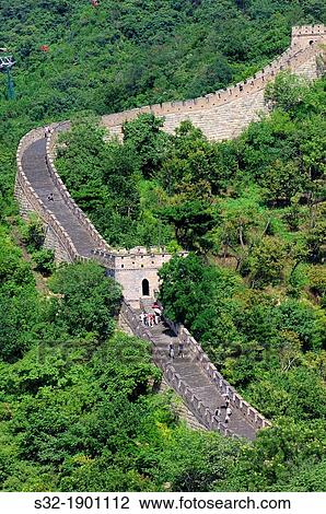 Stock Image - Tourists walk on the Simatai Great Wall of China, Beijing, China. Fotosearch