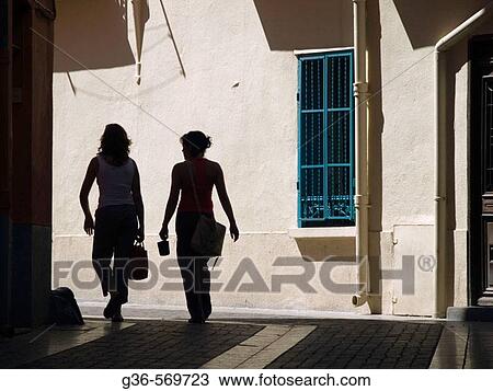 Tourists walk through the sun drenched streets of Colliores, France on the Mediterranean coast. View Large Photo Image Stock Image - Tourists walk through the sun drenched streets of Colliores, France on the Mediterranean coast.. Fotosearch