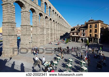 tourists walking under the aqueduct of Segovia, Castilla Leon, Spain. View Large Photo Image Stock Image - tourists walking under the aqueduct of Segovia, Castilla Leon, Spain.. Fotosearch