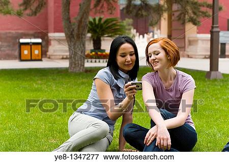Tourists watching pictures in their camera, The Forbidden City, Beijing, China, Asia MR View Large Photo Image Stock Photo - Tourists watching pictures in their camera, The Forbidden City, Beijing, China, Asia MR. Fotosearch
